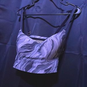 A Pink grey and black marble patterned wireless pullover bra.